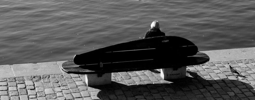 Woman sitting alone on a bench