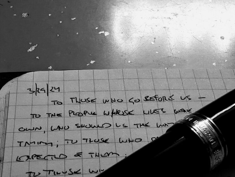 photo of a notebook with a fountain pen